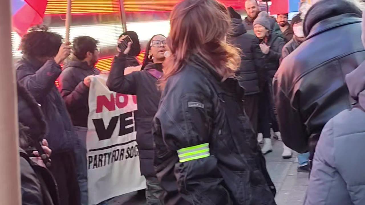 "NO ANOTHER WAR FOR OIL" in Times Square.