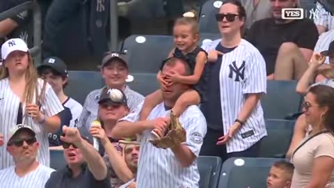 Dad makes no-look catch in stands after daughter covers his eyes at Yankees-Rays game