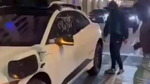 Blacks destroying self driving cars