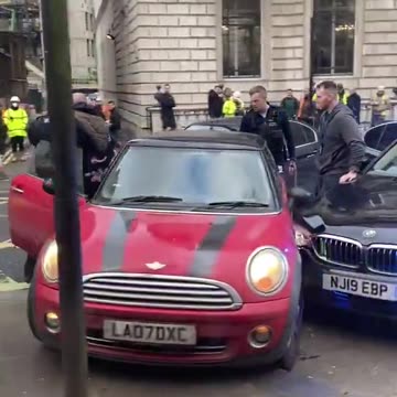 A Mini Cooper on the run tries to evade police capture with quick thinking.