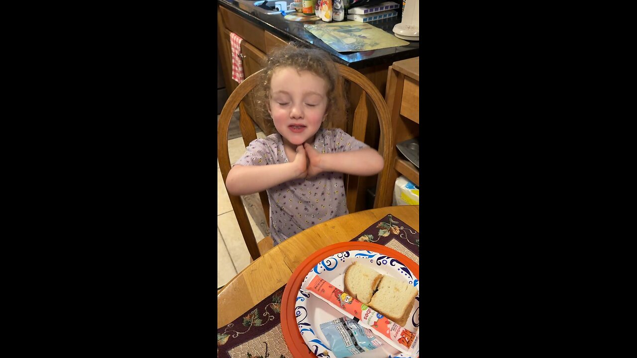 Granddaughter blessing our food.