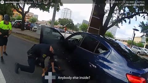Sergeant shoots robbery suspect when officer was pinned inside the open door as the suspect took off