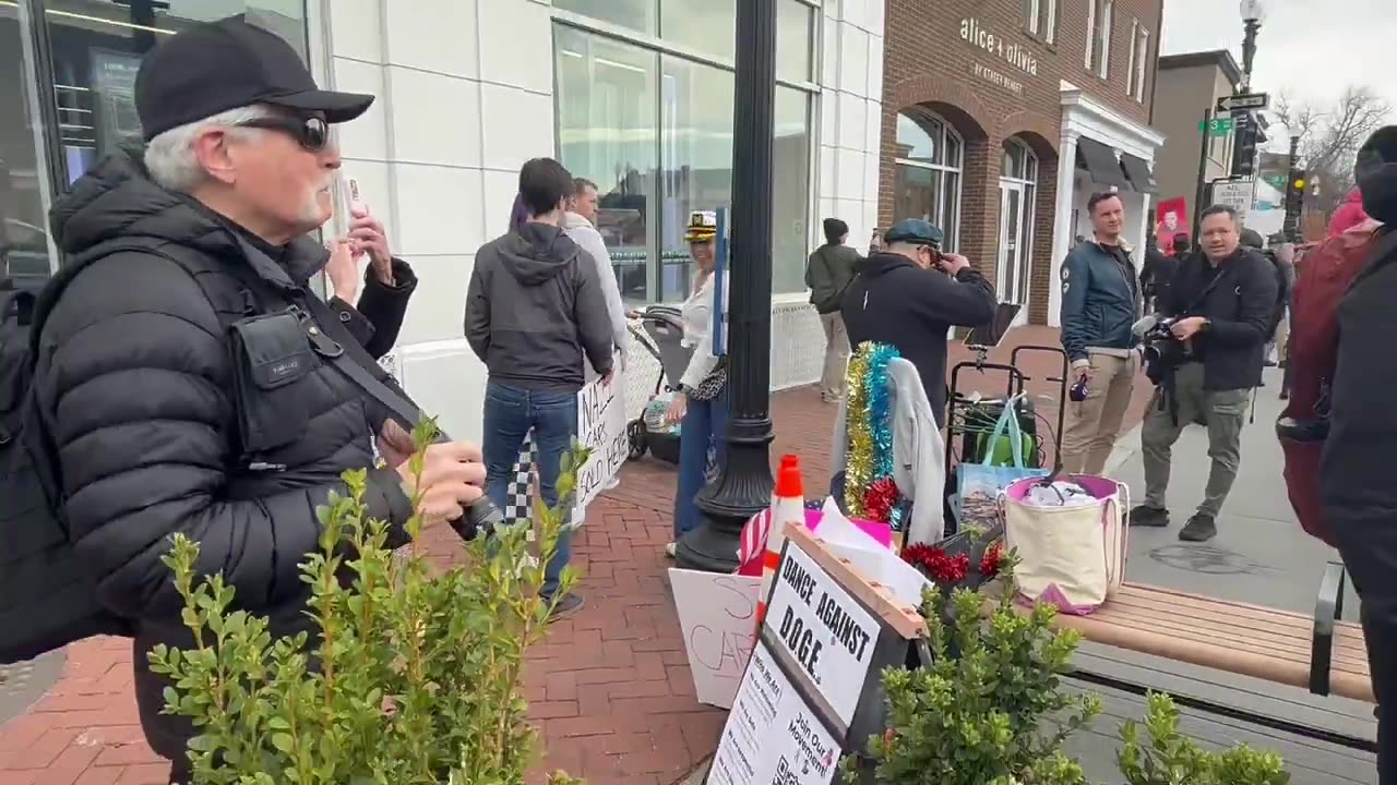 The Elon Musk Tesla protests ARE PAID Watch as these protesters pick through