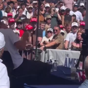 New angle shows Charlie Kirk’s team jumping to save him as shots are fired.