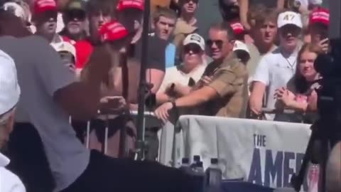 New angle shows Charlie Kirk’s team jumping to save him as shots are fired.