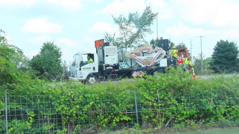 Road Construction crew putting down Cones