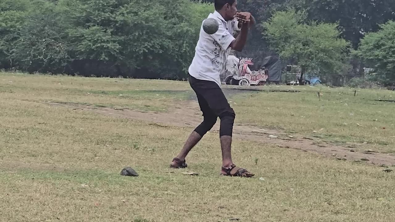Man Falls While Throwing a Shot Put Ball