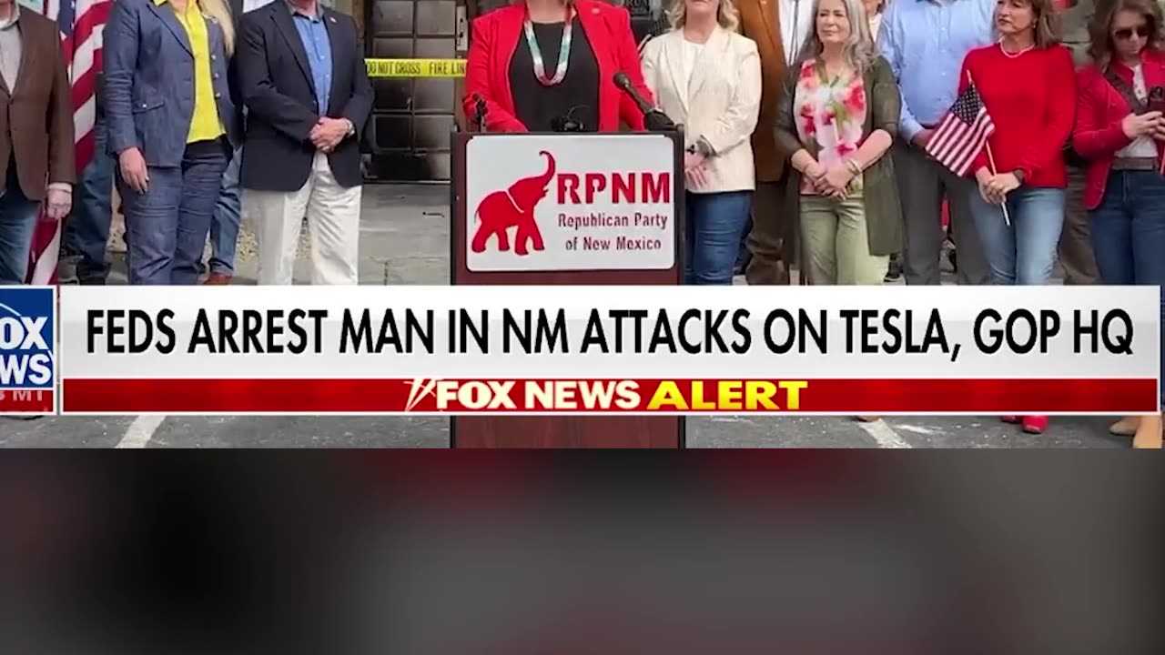 Police have charged a suspect in connection to attacks on a Tesla showroom