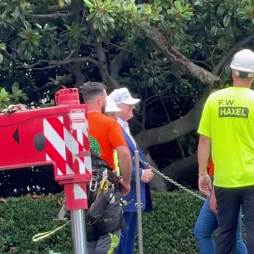President Trump greets and thanks workers assembling the flagpole on the South Lawn