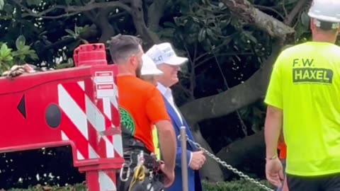 President Trump greets and thanks workers assembling the flagpole on the South Lawn