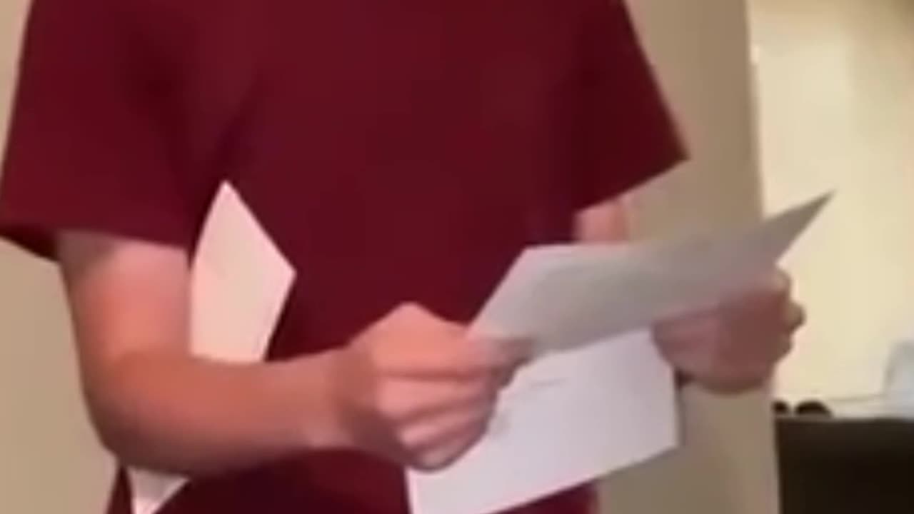 Tyler Robinson reads an acceptance letter for a $32,000