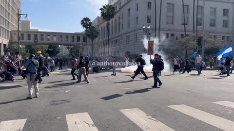 CHAOS is unfolding quickly as more tear gas is launched toward protestors.