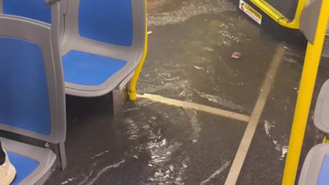 NYC Bus Drives Through Flooded Street