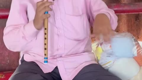 Blind Man Plays Flute