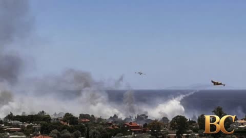 Homes burn in Greece as wildfire sweeps through coastal towns