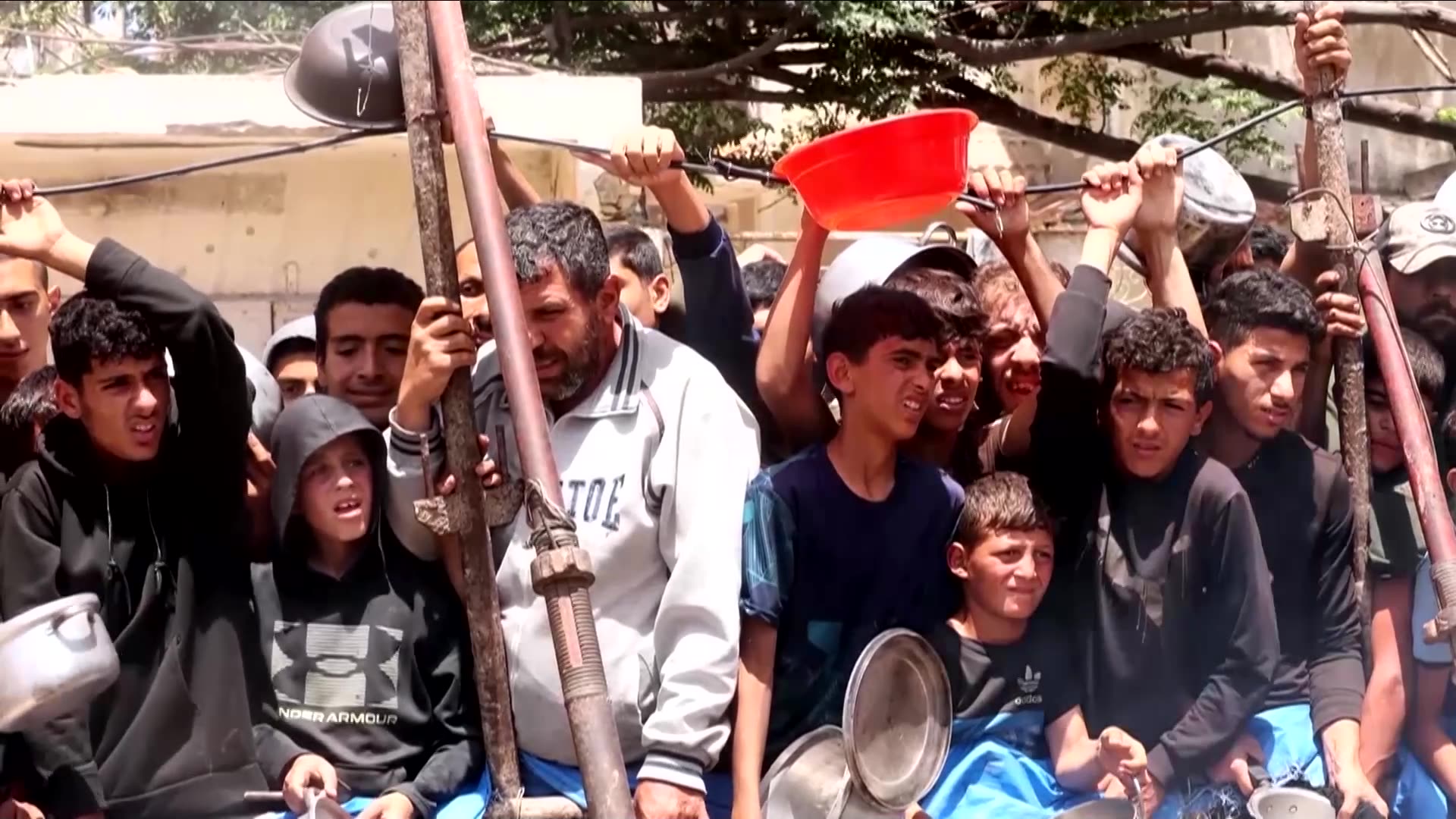 Under pressure, Israel lets some bread and baby food reach Gazans