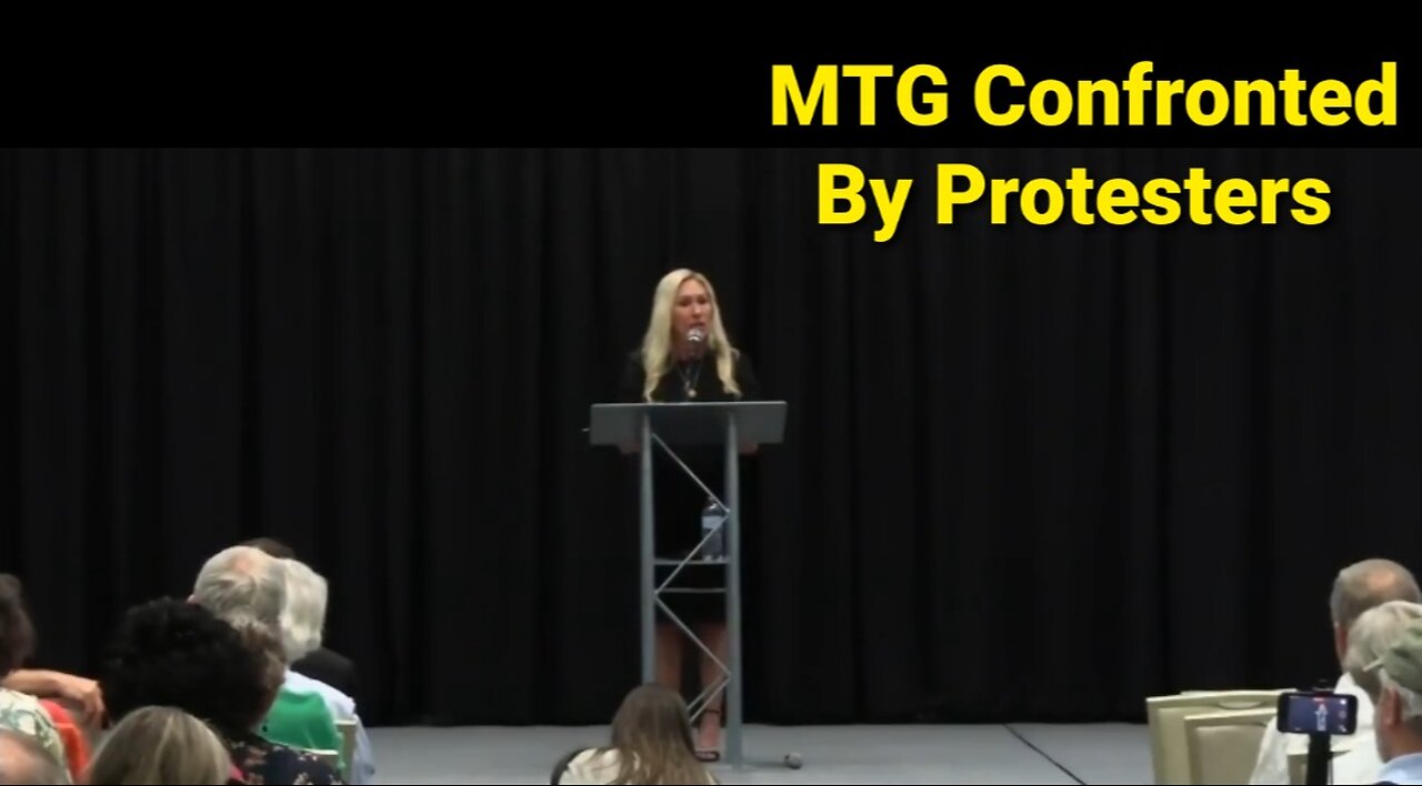 Marjorie Taylor Greene Confronted By Protesters & Stock Trading