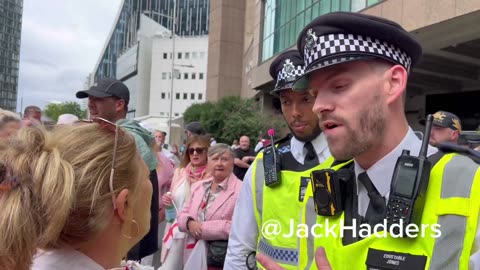 Police officers are now trying to persuade the women and children...