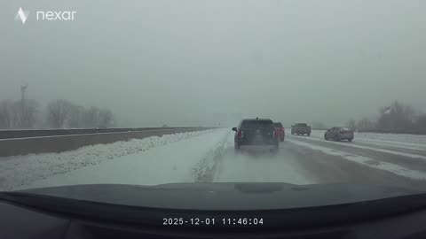 SUV Slides Across Several Lanes During Snowstorm