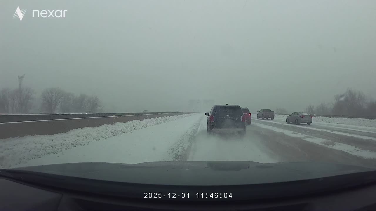 SUV Slides Across Several Lanes During Snowstorm