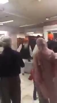 Mirrored: Sikh Man Takes Out Sword in Gurdwara Fight