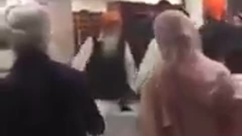 Mirrored: Sikh Man Takes Out Sword in Gurdwara Fight