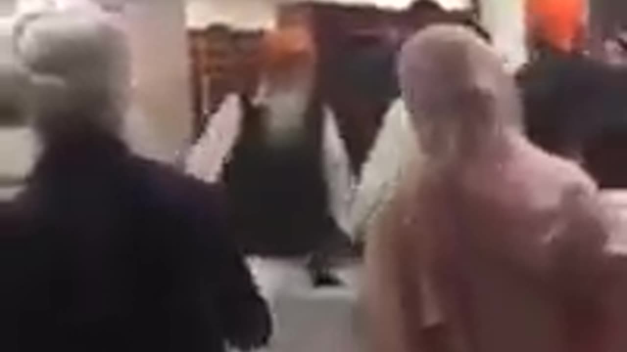 Mirrored: Sikh Man Takes Out Sword in Gurdwara Fight
