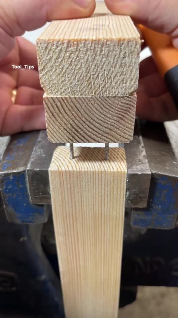 Wooden Block with Metal Pins Secured in Bench Vise