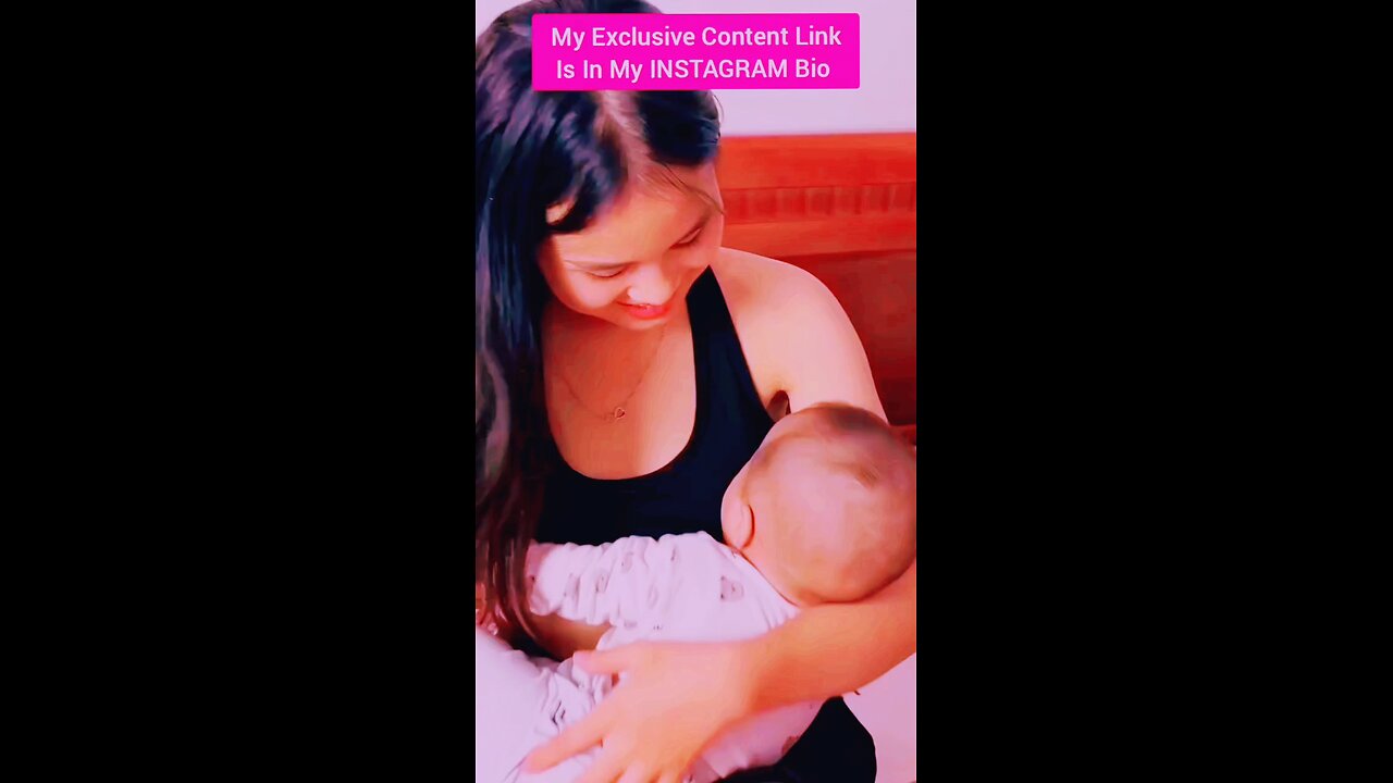 The little baby is drinking mother's milk.