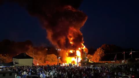 Migrant boat effigy torched on bonfire investigated as hate crime