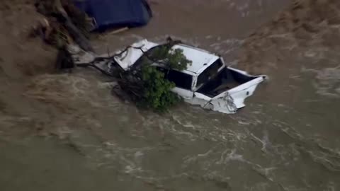 Aerial footage shows cars swept out to sea as floods hit Australia