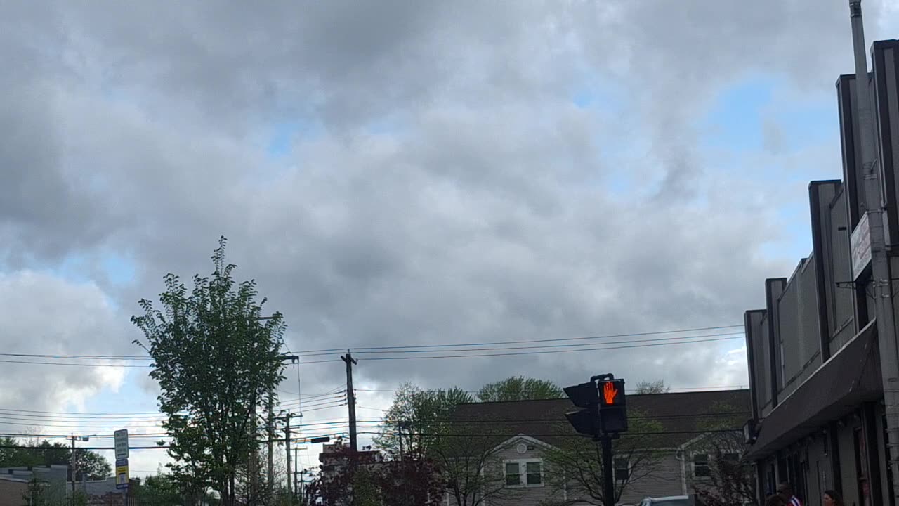 Layers of "clouds", in the atmosphere.(blocking the direct white/yellow sunlight)