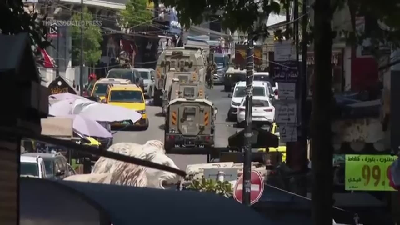 Dozens wounded after gunfire and tear gas as Israel raids West Bank city