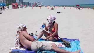 'Melting like an ice cream': Miami Beach visitors on the extreme heat