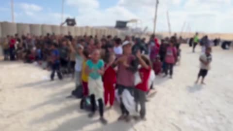 Children at the food distribution in Gaza cheering America America 🇺🇸👍