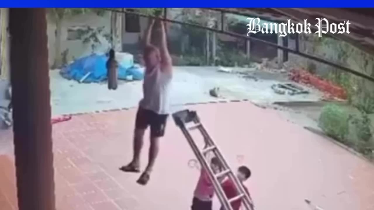 A retired man clung to a roof beam when the ladder beneath him fell down