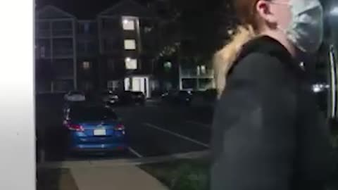 Woman in Mask Seemingly Attempts to Enter Apartment