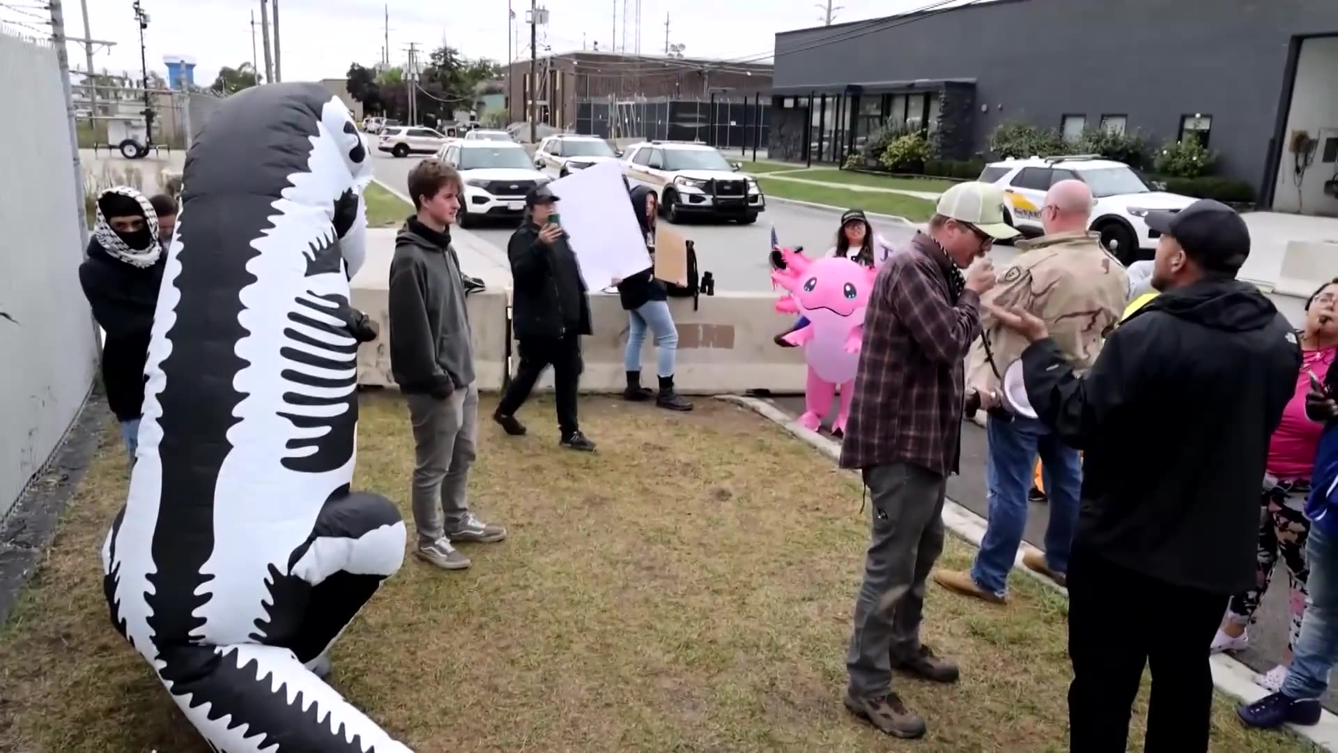 Activists in Bizarre Halloween Costumes Protest ICE Outside Chicago Facility