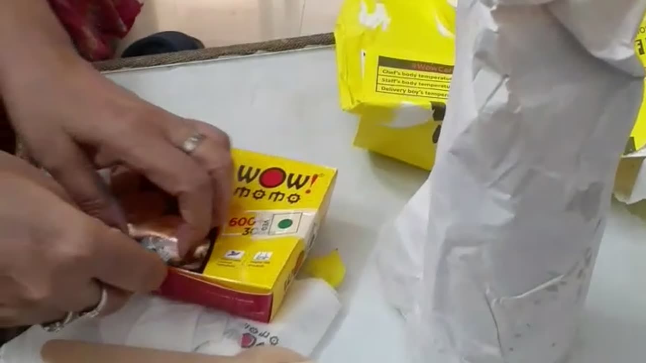 Unwrapping of wow momo order....