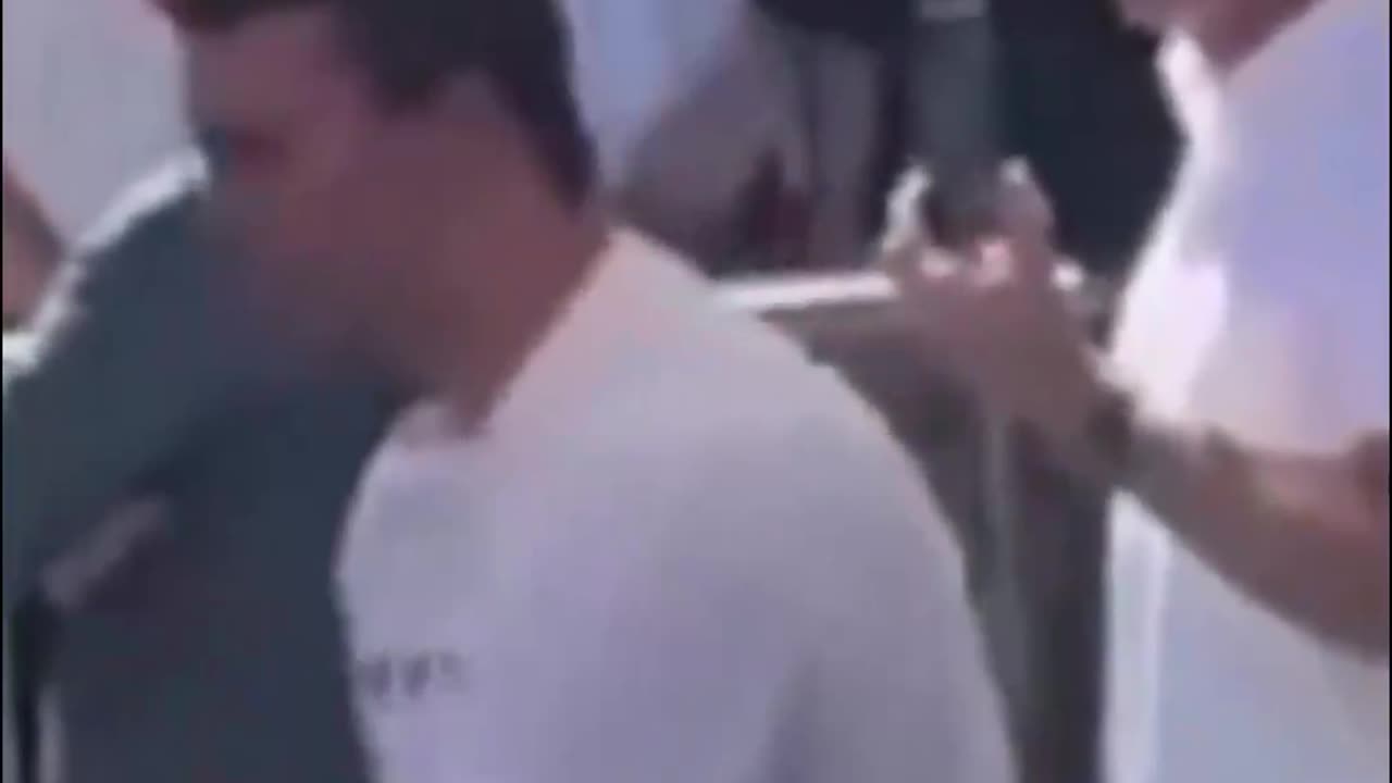 2 men standing behind Charlie Kirk look like they gave hand signals right before the shot went off
