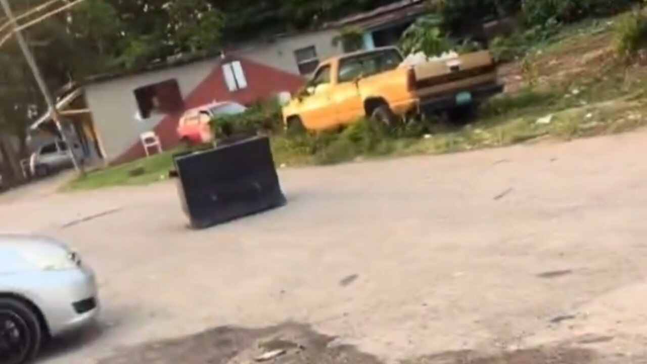 Jamaican man turns a couch into a vehicle
