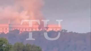 Kiev. From the Russian attack on the government, the building is seen on fire.