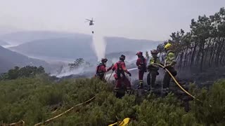 Firefighters in Spain battle flames as wildfires rage
