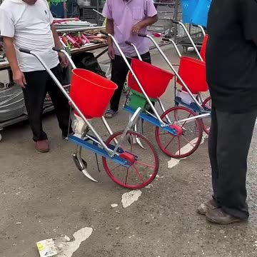 Fertilizer application with wheelbarrow "Agriculture, rural area& farmers" "A good helper for farmer