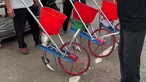 Fertilizer application with wheelbarrow "Agriculture, rural area& farmers" "A good helper for farmer