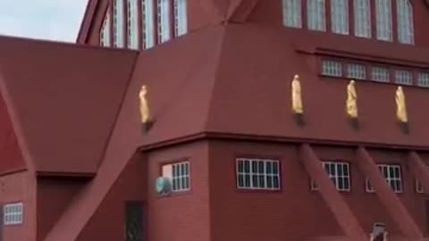 Historic Swedish church moved 5km on giant trailer to new home