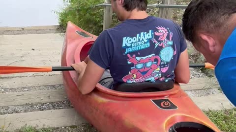 Entering the River via Pushing a Kayak Down the Stairs