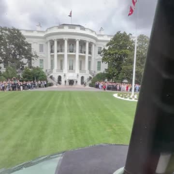 President Donald Trump waves to a crowd of amazing interns at the White House as he takes off in Marine One