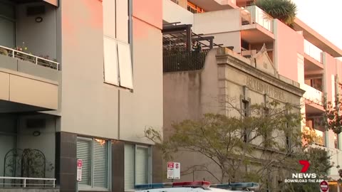 Seven people have been cornered on a Port Melbourne roof ...