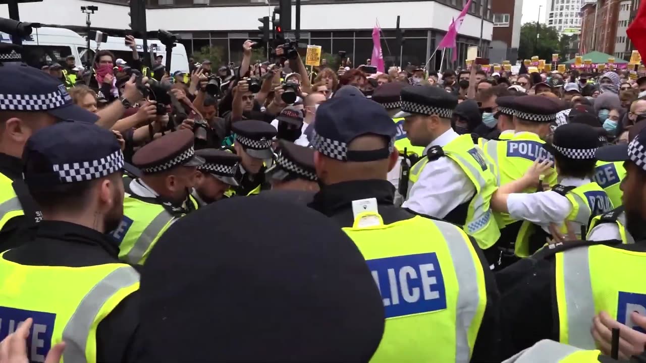 Police arrest protesters outside hotel housing immigrants
